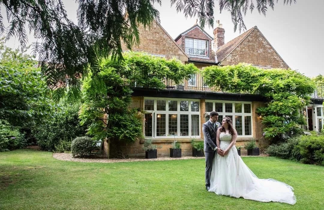 Bride and groom portrait by Studio H Photography