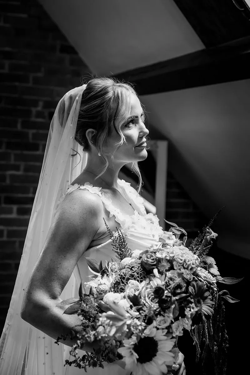 Bridal portrait with bouquet, in black and white