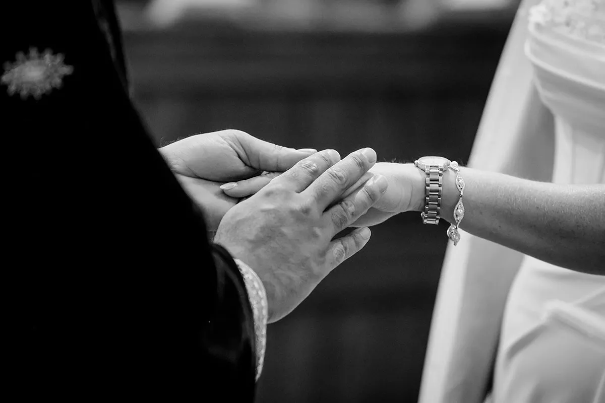Exchanging rings, photographed in black and white