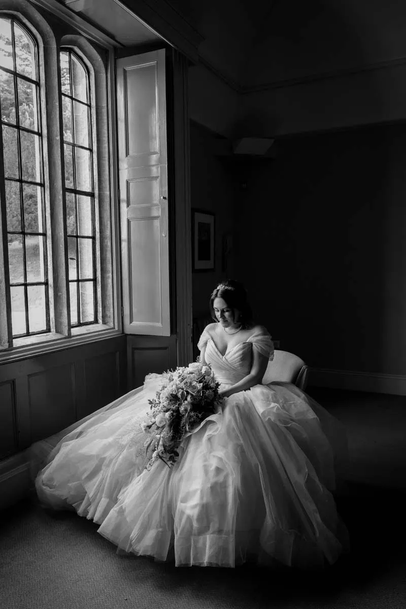 The bride in her dress before the ceremony, in black and white