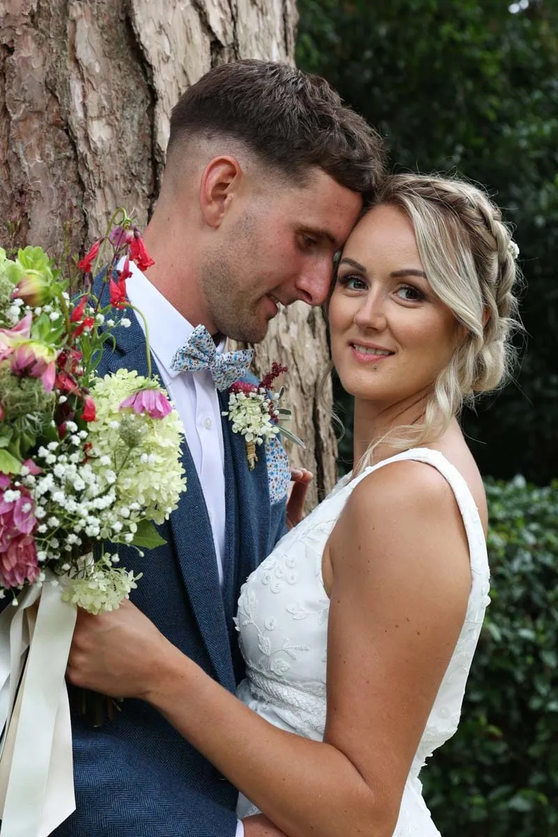 Bride and groom portrait by Studio H Photography