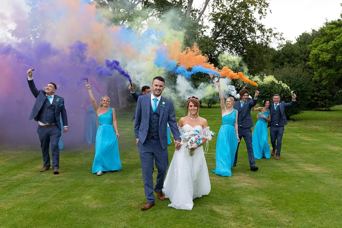Wedding party with colourful smoke: a modern celebration